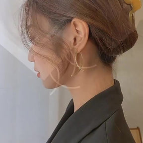 Brincos Longos Cruzados