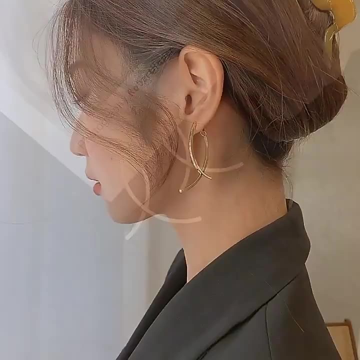 Brincos Longos Cruzados